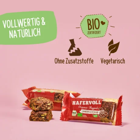 HAFERVOLL Organic Flapjack Cranberry & Cocoa Nib 60g – verpackt und ausgepackt mit Bio-Hinweisen